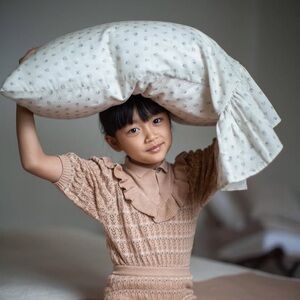 Elegant Cream Pillowcase with Ruffle Design